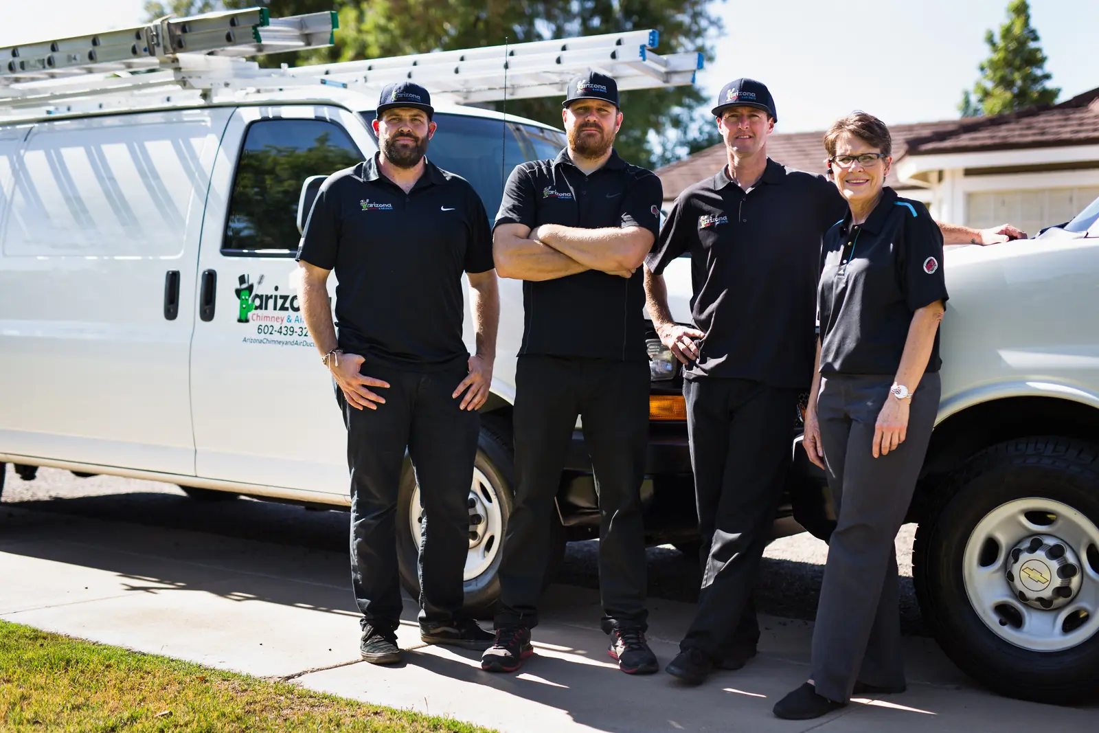 Arizona Chimney & Air Ducts team in front of a company van