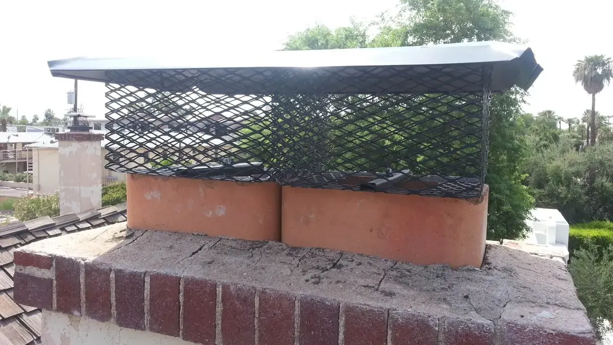 Chimney cap on a red brick chimney