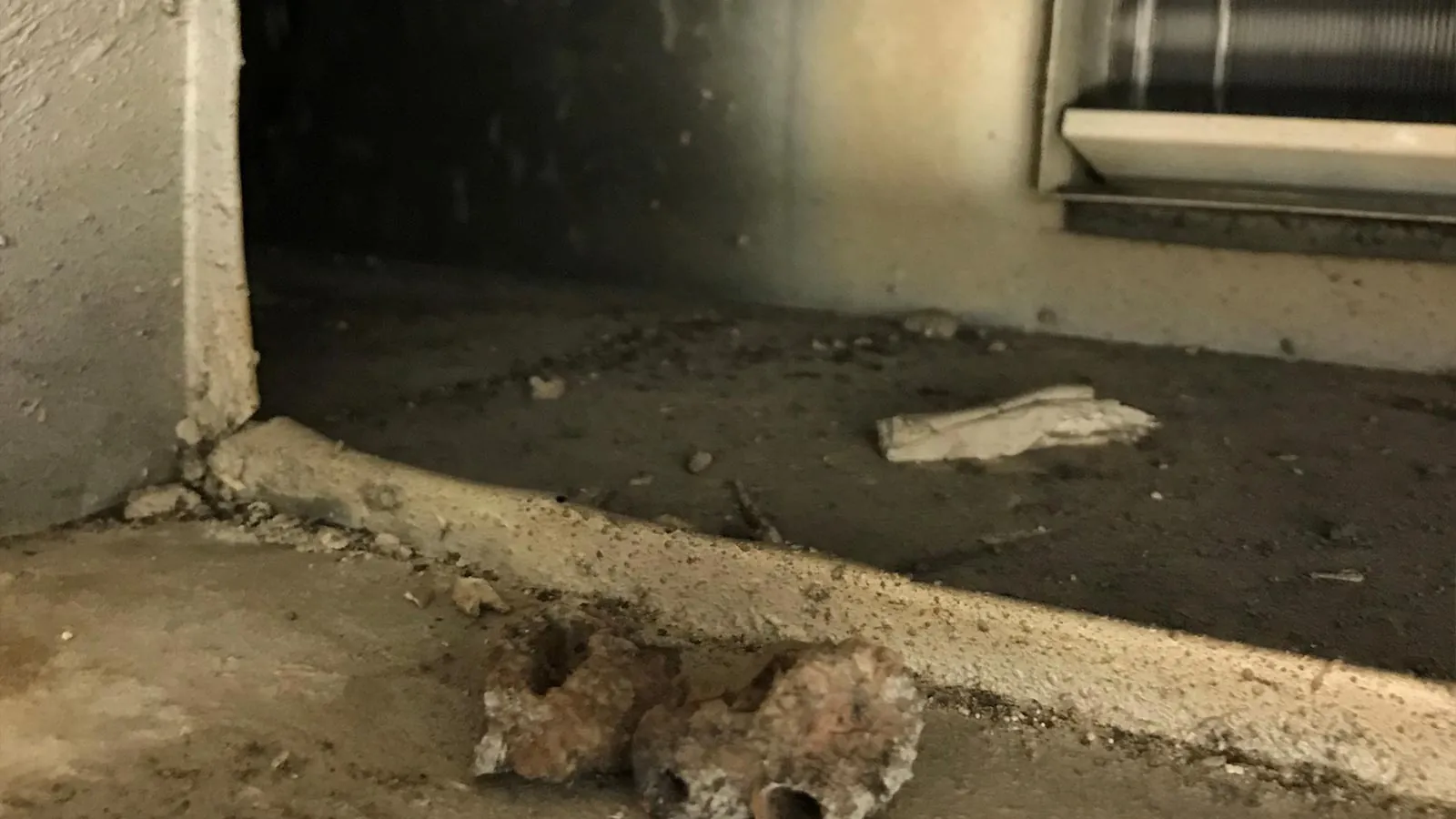 Debris and insulation inside an air duct