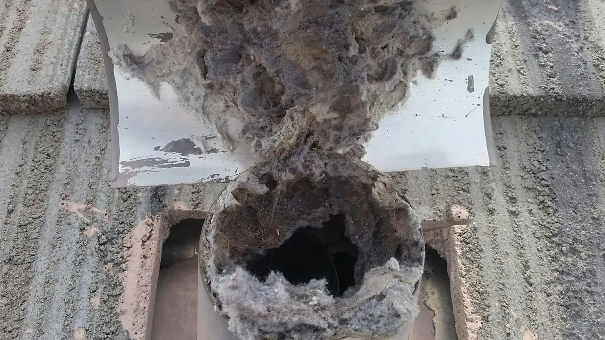 Dryer vent packed with lint before cleaning by Arizona Chimney & Air Ducts in Phoenix