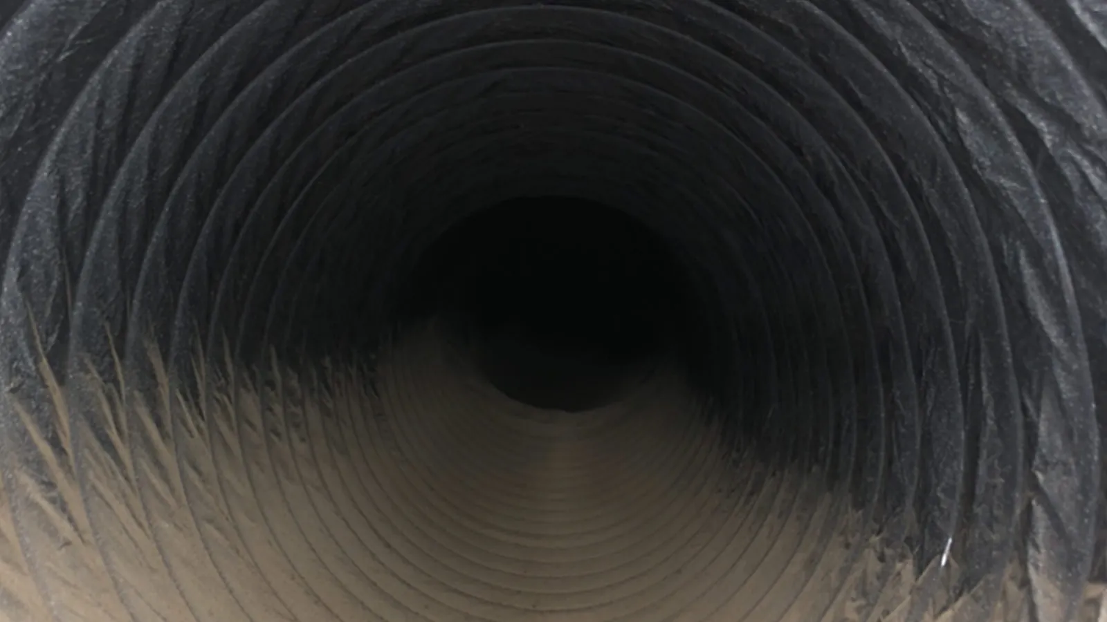 Dusty flex air duct before cleaning