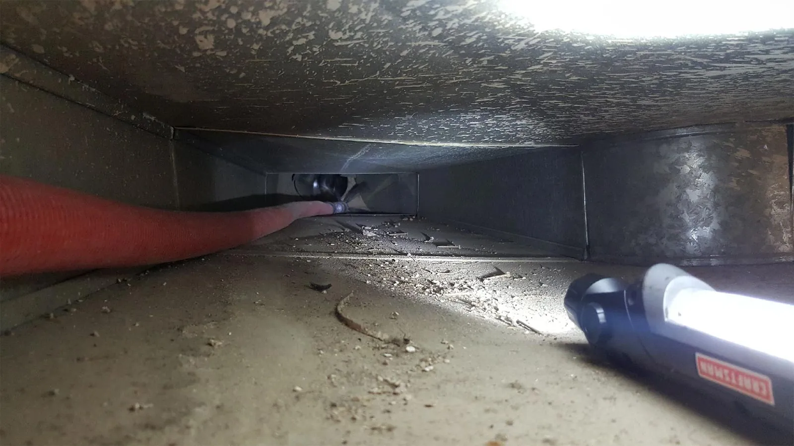 Inside an air duct during cleaning