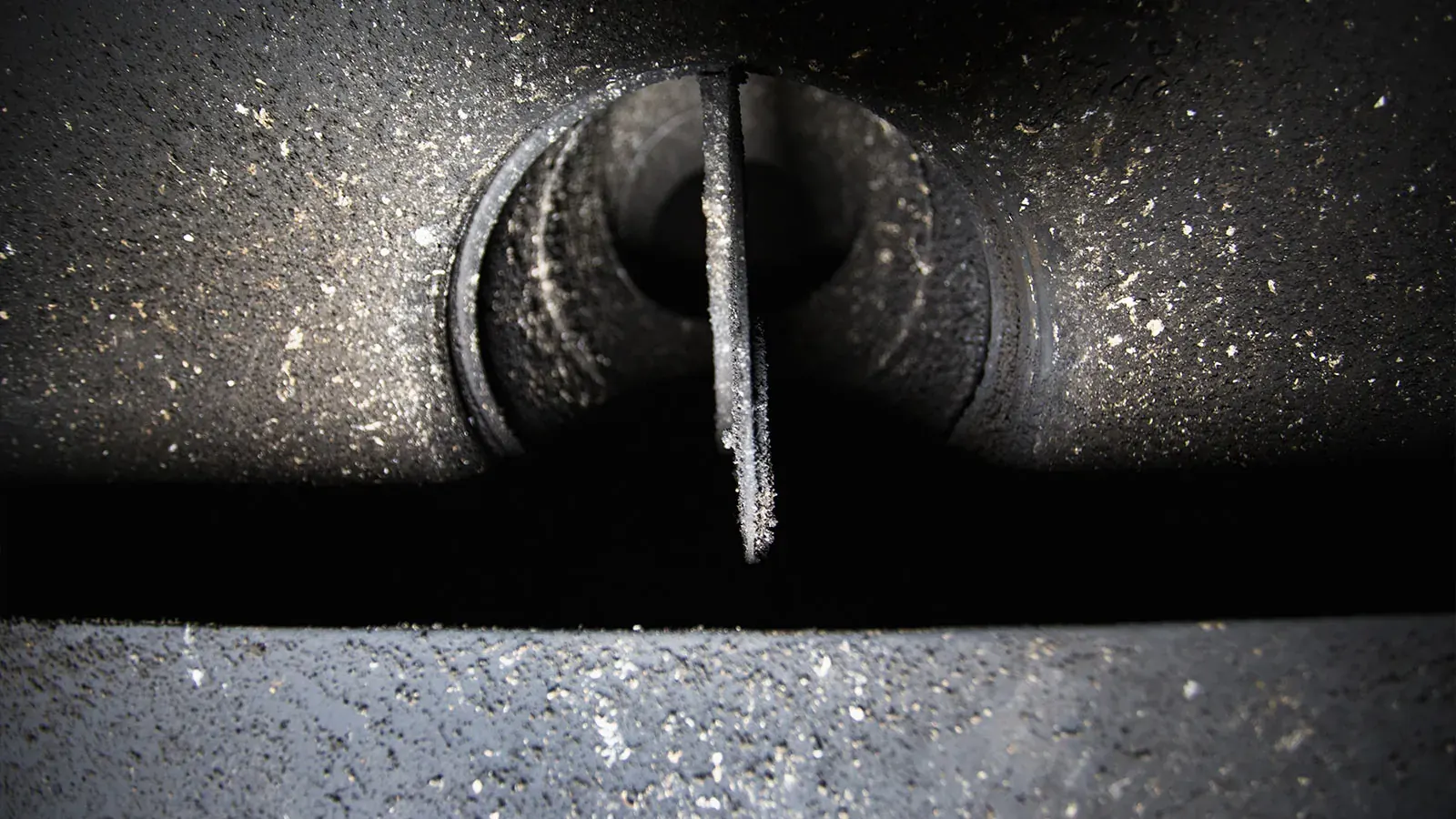 Soot coating a damper and flue