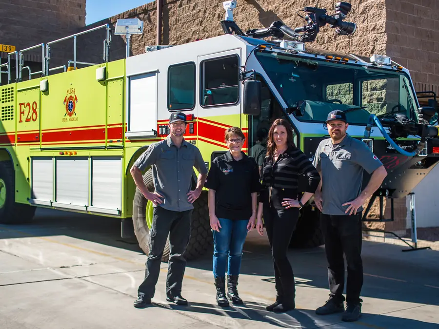 Arizona Chimney & Air Ducts team with Mesa Fire and Medical in front of a fire engine