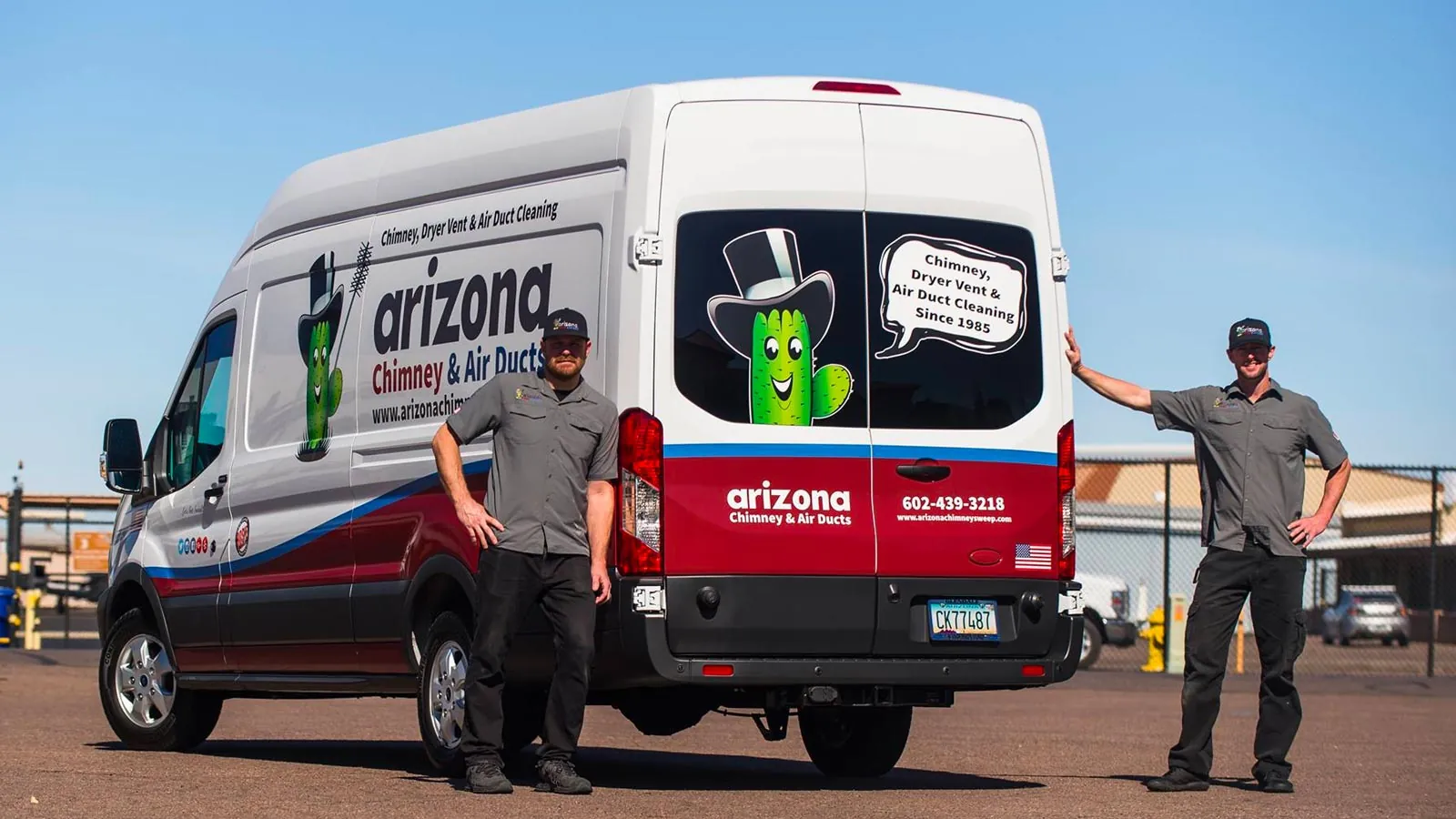 Two Arizona Chimney & Air Ducts technicians beside the company van